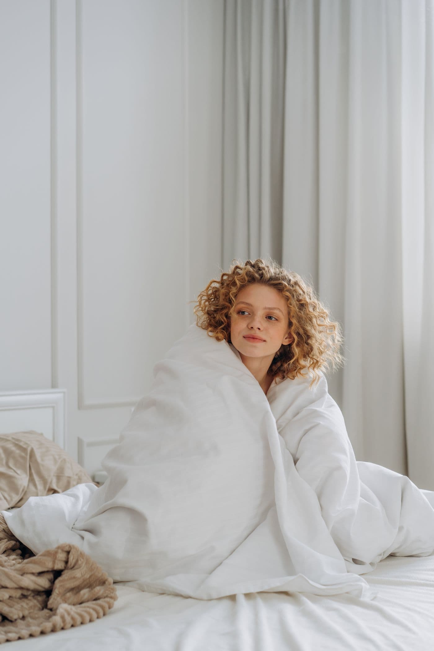 Person wrapped in a blanket on a cozy morning