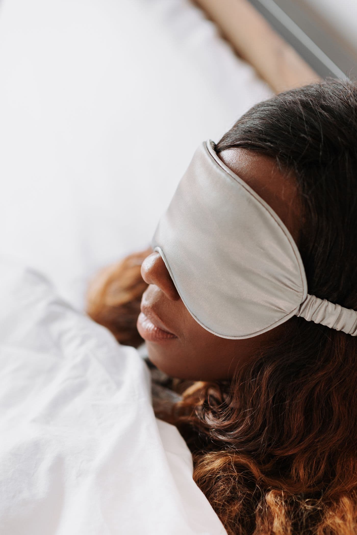 Woman resting peacefully in bed