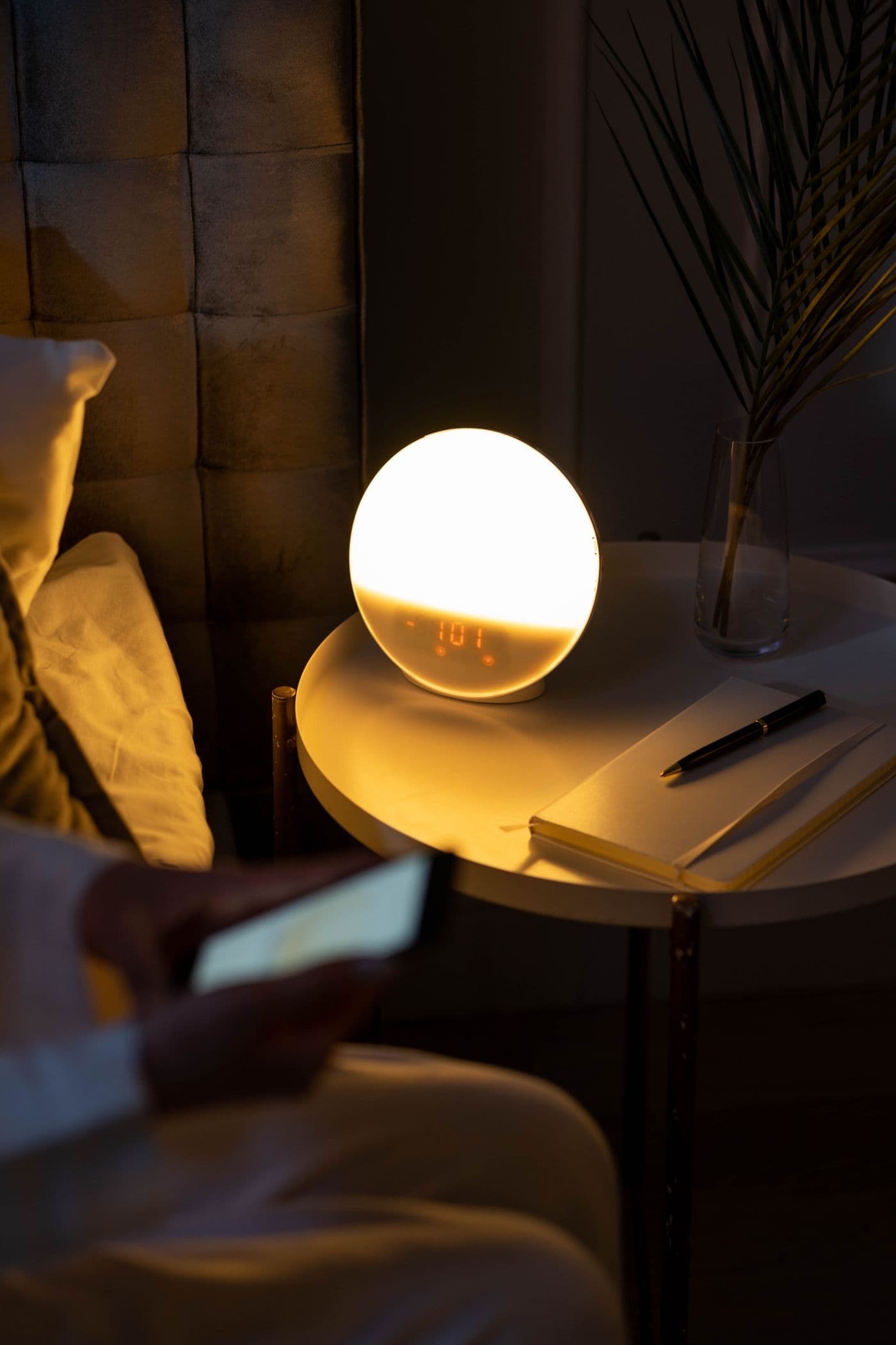 Smart alarm clock on a bedside table